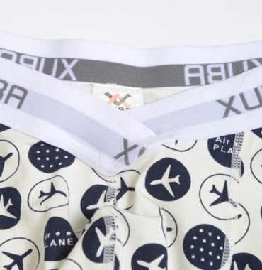 First Class white smoke cotton boxer decorated with planes and stars and contains a grey belt