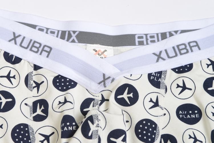 First Class white smoke cotton boxer decorated with planes and stars and contains a grey belt