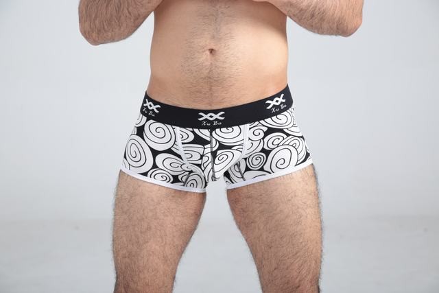 First class black cotton boxer decorated with beige circles and contains black belt