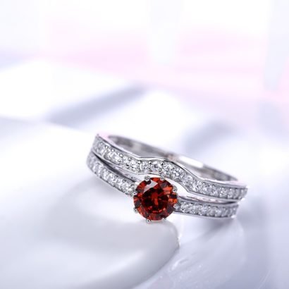 Luxurious silver 925 ring inlaid with red zircon bezel and side white special crystals