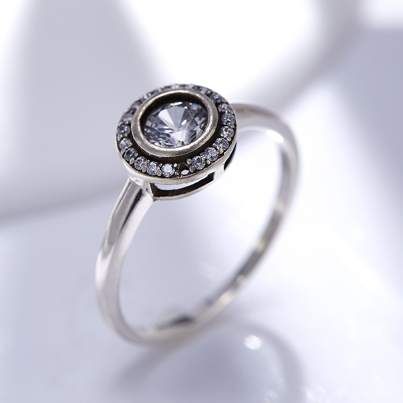 Sterling 925 silver ring inlaid with white crystals in a circular design