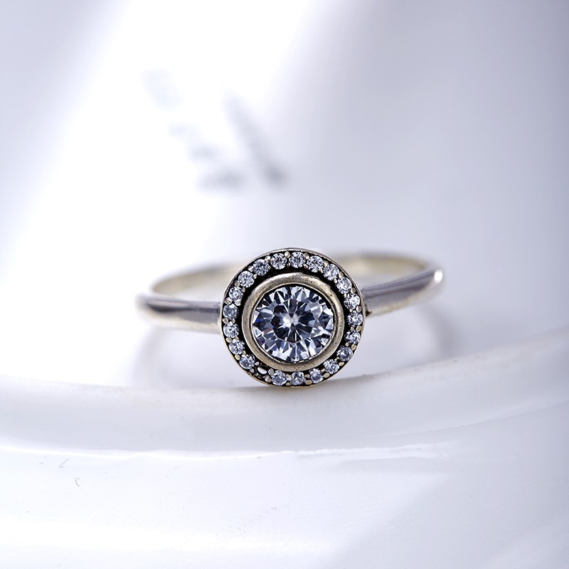 Sterling 925 silver ring inlaid with white crystals in a circular design