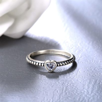 The white heart ring has a simple design from silver and inlaid with zircon