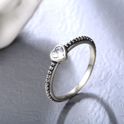 The white heart ring has a simple design from silver and inlaid with zircon