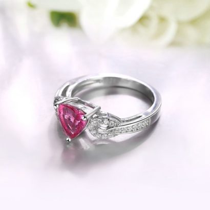 Silver 925 ring with a unique design inlaid with white crystals and a rose heart from zircon