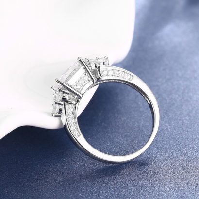 The crown silver ring from pure silver and inlaid with white crystal