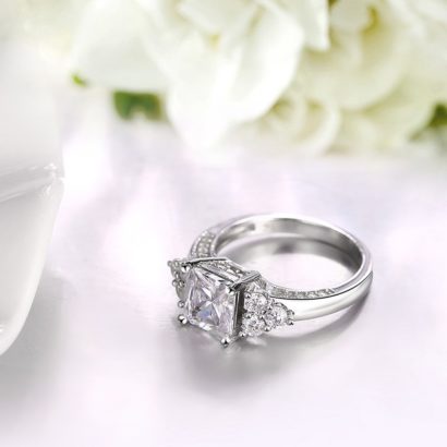 The crown silver ring from pure silver and inlaid with white crystal