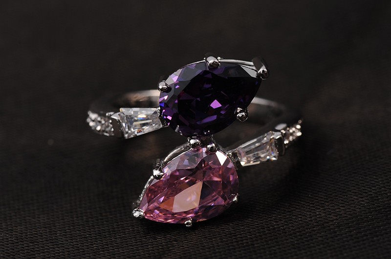 Special copper ring inlaid with white crystals and two big Violet and pink zircons