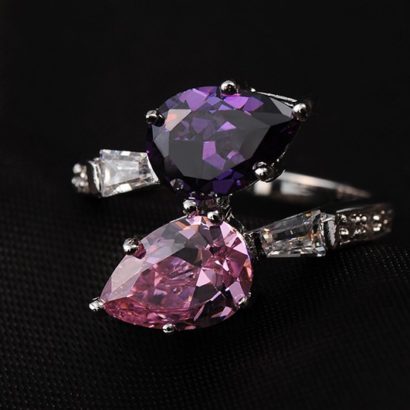 Special copper ring inlaid with white crystals and two big Violet and pink zircons
