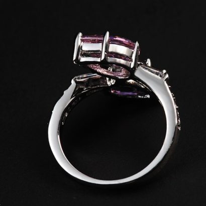 Special copper ring inlaid with white crystals and two big Violet and pink zircons