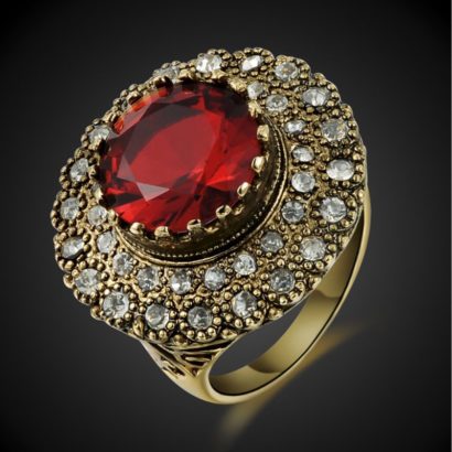 Copper ring three times of gold plating with a classical design and inlaid with red zircon