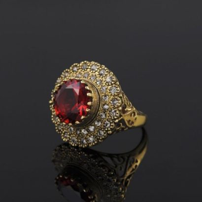 Copper ring three times of gold plating with a classical design and inlaid with red zircon