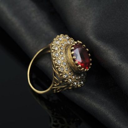 Copper ring three times of gold plating with a classical design and inlaid with red zircon
