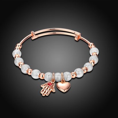 Heart and hand bracelet, gold plated, has a unique design which allows it to be customized