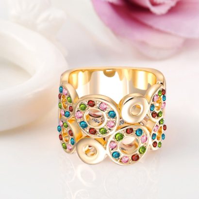 Unique design of gold plated 18K ring, decorated with circular shapes inlaid with colored zircon