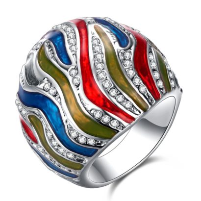 A unique ring plated with platinum and inlaid with diamond crystals and decorated by colored oil drip