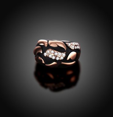 Water drop is a unique ring plated with rose gold and inlaid with diamond crystals and decorated by black oil drip