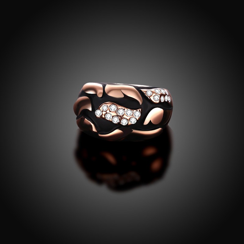 Water drop is a unique ring plated with rose gold and inlaid with diamond crystals and decorated by black oil drip