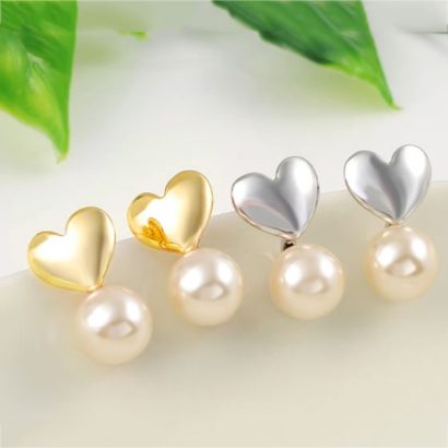 The connected heart and Pearl earring is three times gold plated