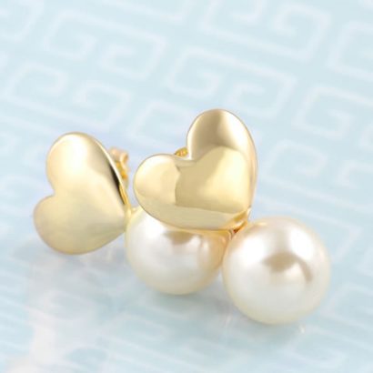 The connected heart and Pearl earring is three times gold plated
