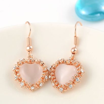The pink Heart earring, three times gold plated and inlaid with pink opal surrounded by special crystals