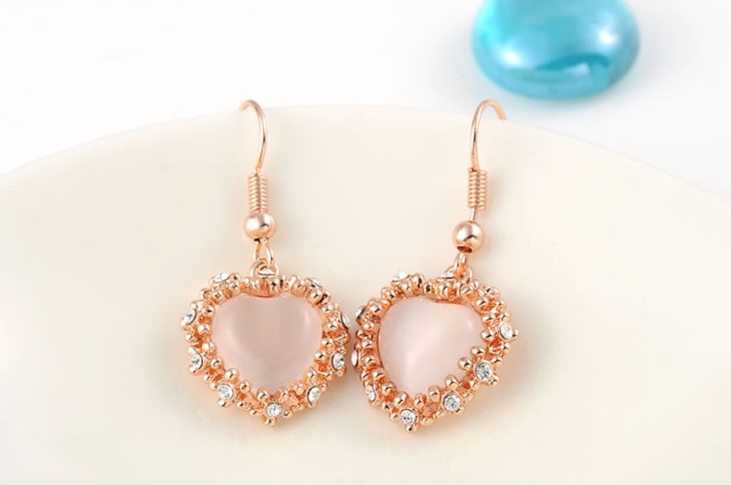 The pink Heart earring, three times gold plated and inlaid with pink opal surrounded by special crystals