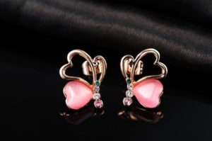 Love Hearts earring, has a unique design, three times gold plated and inlaid with pink pearl and colored crystals