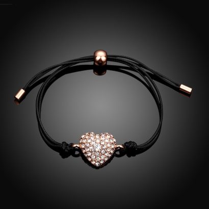 Leather bangle inlaid with special rose gold pieces and a heart of diamond