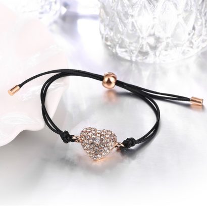Leather bangle inlaid with special rose gold pieces and a heart of diamond