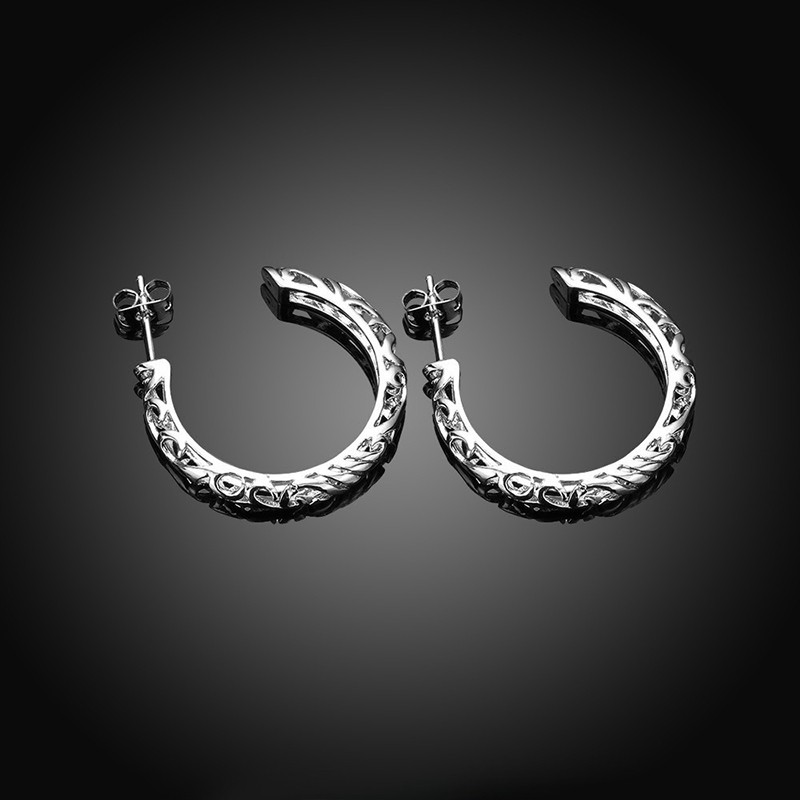 Special earring with Meander decoration and plated with silver