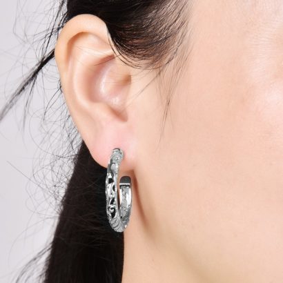 Special earring with Meander decoration and plated with silver