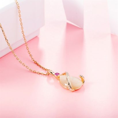 A special necklace plated with gold and inlaid with red crystal diamond, white crystal diamond and a big opal in the middle