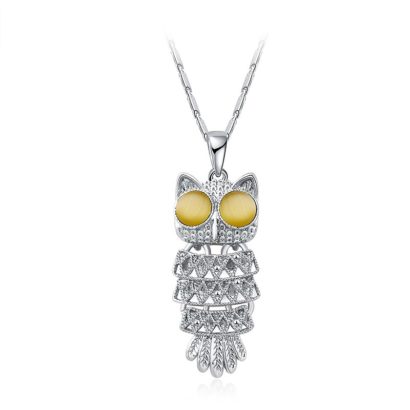 The owl necklace plated with platinum and the eyes are inlaid with brown opals.