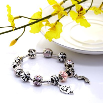 Lovely mother and daughter bangle inlaid with pink crystals and special ornaments