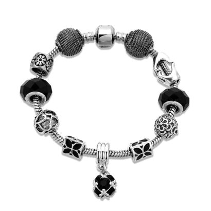 Silver bangle inlaid with special ornaments and a black crystal diamond