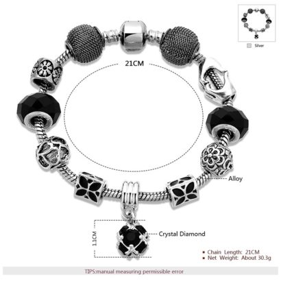 Silver bangle inlaid with special ornaments and a black crystal diamond