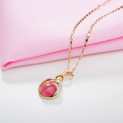 Unique design gold plated necklace inlaid with white crystals and pink opal