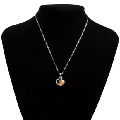 Heart necklace, plated with gold and inlaid with white crystals and an orange opal