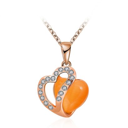 Heart necklace, plated with gold and inlaid with white crystals and an orange opal