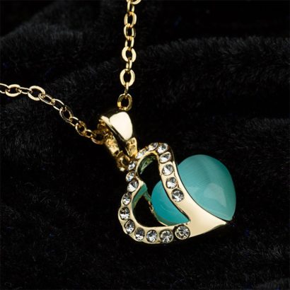 Heart necklace, plated with gold and inlaid with white crystals and a sky blue opal