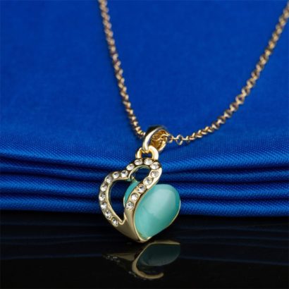 Heart necklace, plated with gold and inlaid with white crystals and a sky blue opal