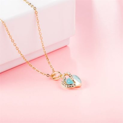 Heart necklace, plated with gold and inlaid with white crystals and a sky blue opal