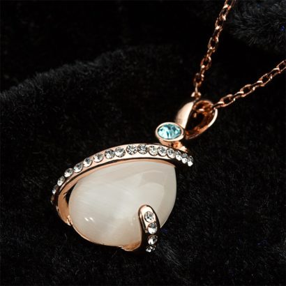 A special necklace, plated with gold and inlaid with blue crystal diamond, white crystal diamond and a big opal in the middle