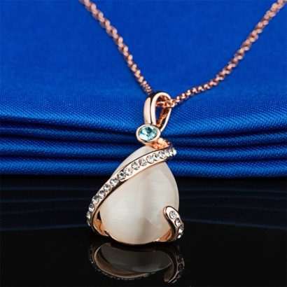 A special necklace, plated with gold and inlaid with blue crystal diamond, white crystal diamond and a big opal in the middle