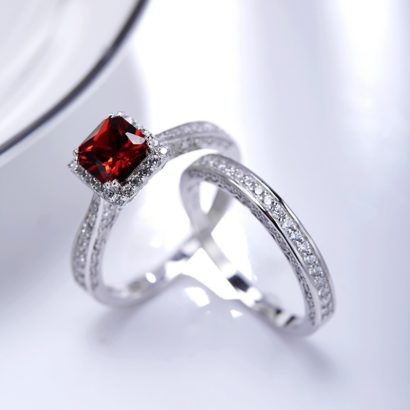 Luxurious silver 925 twins ring inlaid with red zircon and side white special crystals